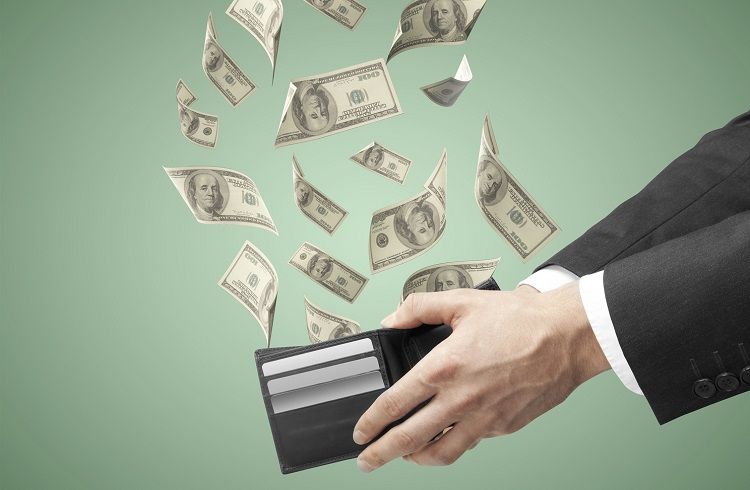purse from which emerge dollars